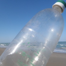Single-use Plastic plastic bottle from Cuba on beach