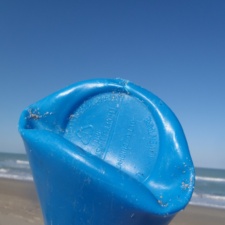 Plastic Pollution Foreign plastic bottle on beach