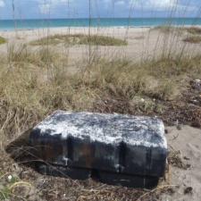 Plastic Pollution Plastic pontoon filled with small, polystyrene balls