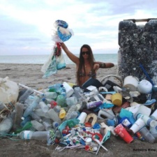 The earth is being choked by plastic Pile of plastic, balloons and other beach debris