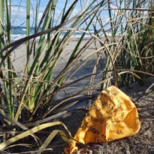 Balloon Pollution latex balloon with quote from christian bible polluting beach