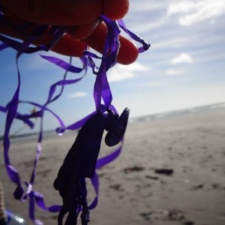 Inchydoney Beach, Ireland latex balloon with ribbon polluting Inchydoney beach, Ireland
