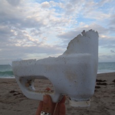 Plastic Pollution top half of a plastic container, nibbled